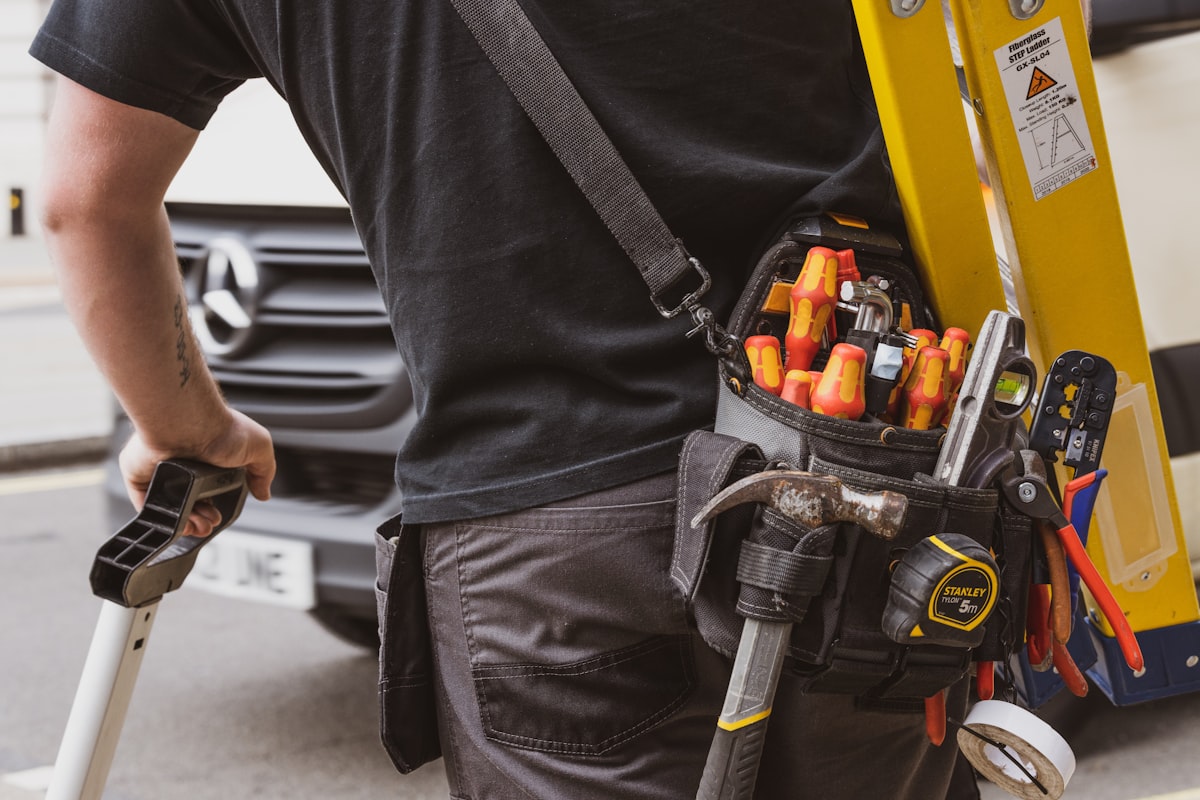 Professional service technician arriving with tools