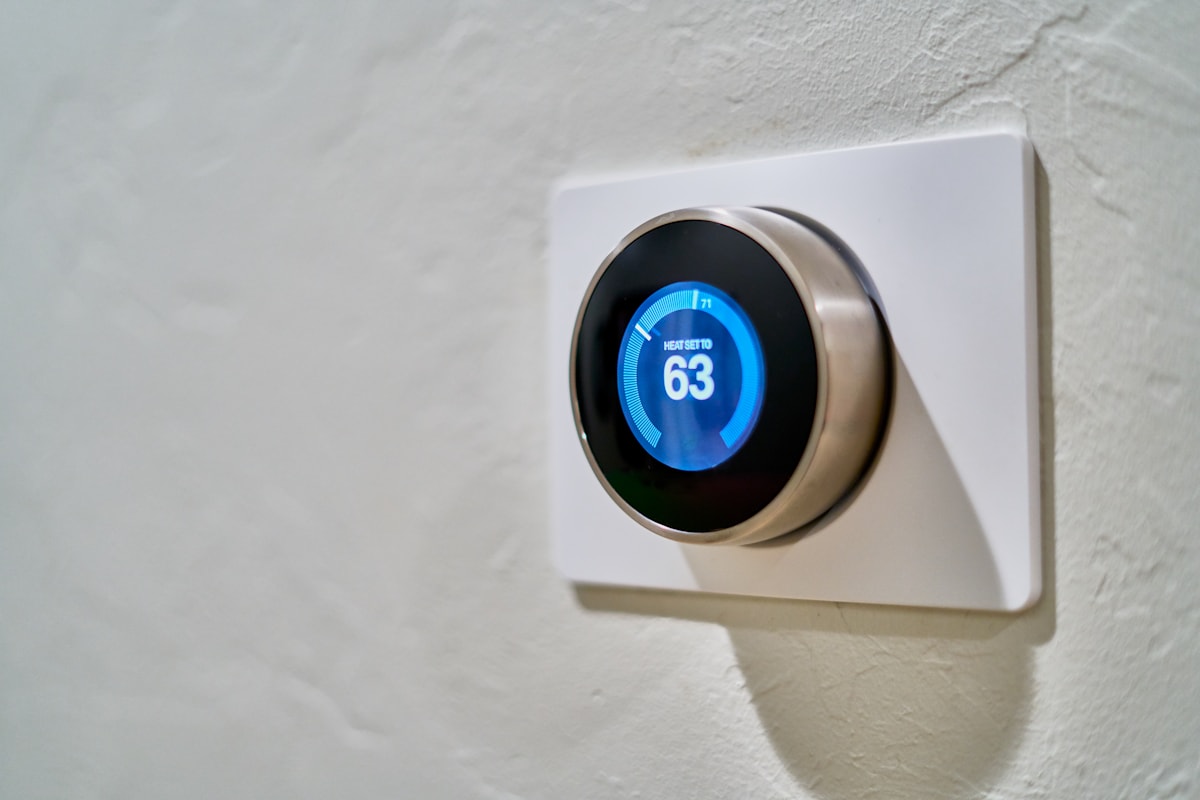 Modern thermostat mounted on a home wall